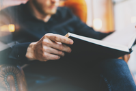 man reading business book