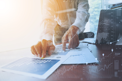 man looking at financial reports