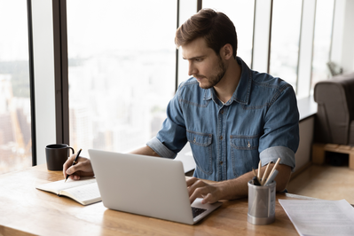 man taking a business course online