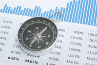 compass sitting on page of results